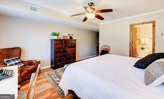 bedroom with hardwood / wood-style flooring, ceiling fan, connected bathroom, and crown molding