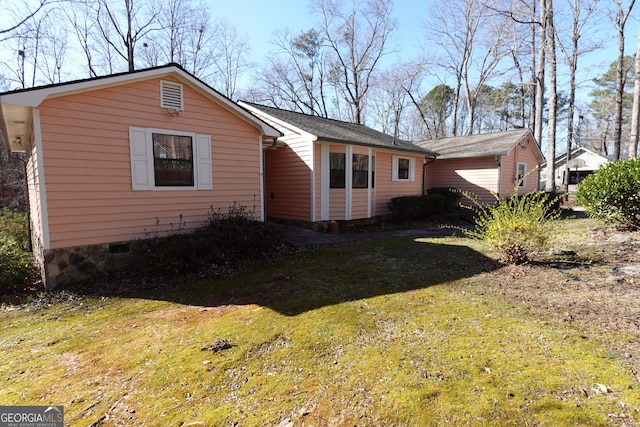 exterior space featuring a lawn