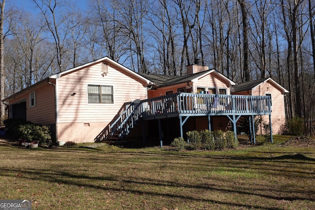 rear view of house featuring stairway, crawl space, a wooden deck, a lawn, and a chimney