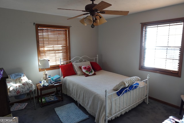 bedroom featuring ceiling fan, carpet, and baseboards