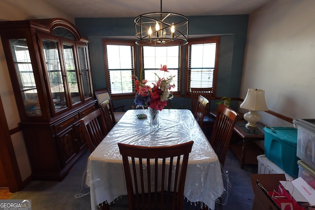 dining space with an inviting chandelier