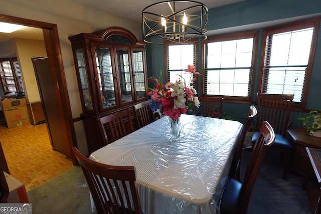 dining room with a notable chandelier