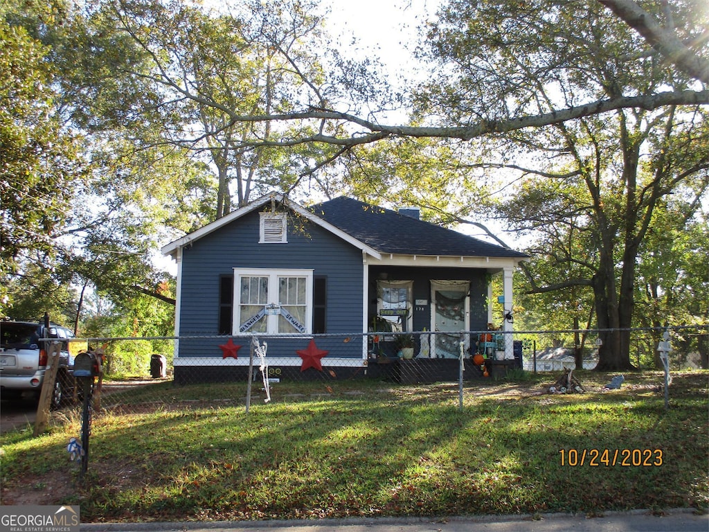 bungalow with a front yard