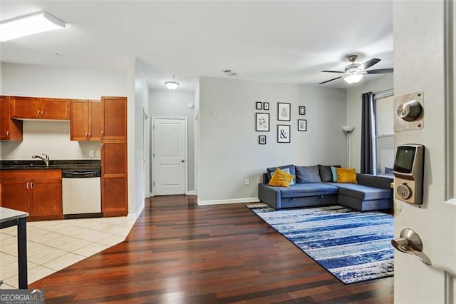 living room with wood-type flooring and ceiling fan