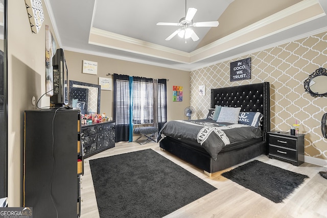 4901 Planters Walk, Douglasville, GA 30135 - bedroom with crown molding, a tray ceiling, light hardwood / wood-style flooring, and vaulted ceiling