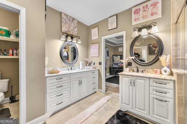 4901 Planters Walk, Douglasville, GA 30135 - bathroom with ornamental molding, vanity, and toilet