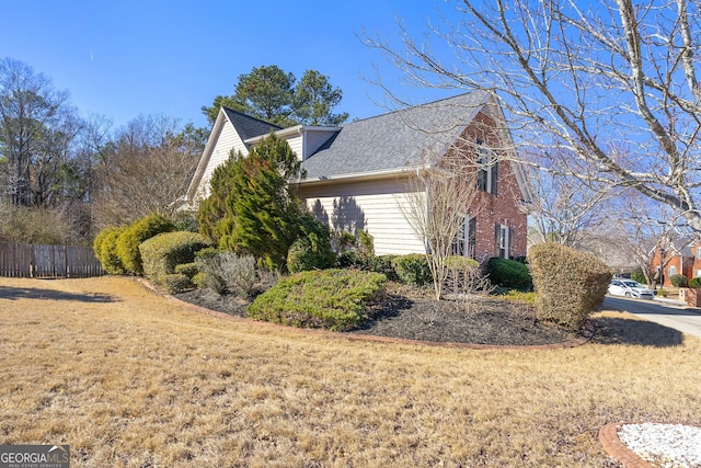 view of home's exterior featuring a lawn