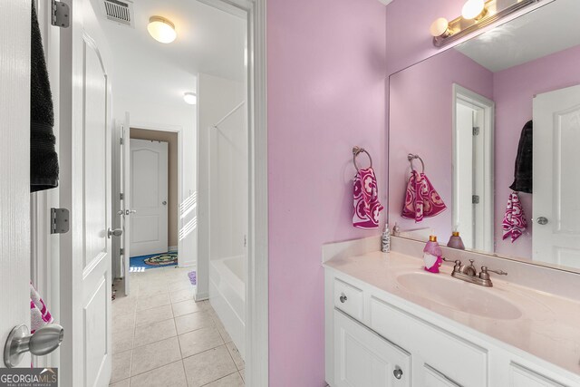 4901 Planters Walk, Douglasville, GA 30135 - bathroom featuring tile patterned floors, vanity, and a washtub