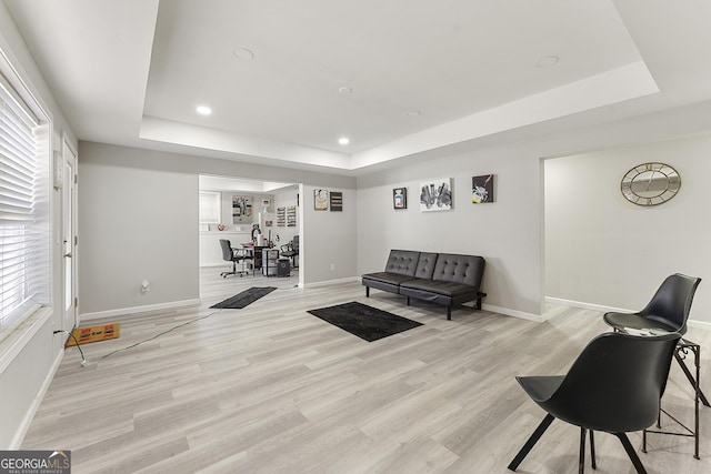 4901 Planters Walk, Douglasville, GA 30135 - living room with a raised ceiling and light hardwood / wood-style floors