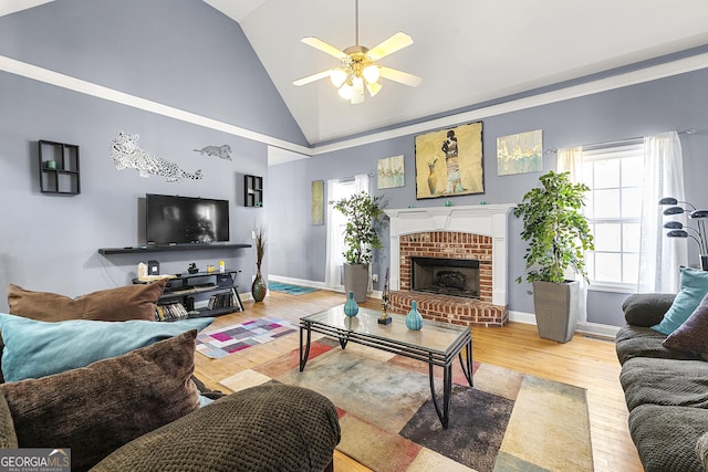4901 Planters Walk, Douglasville, GA 30135 - living room featuring a brick fireplace, light hardwood / wood-style flooring, high vaulted ceiling, and ceiling fan