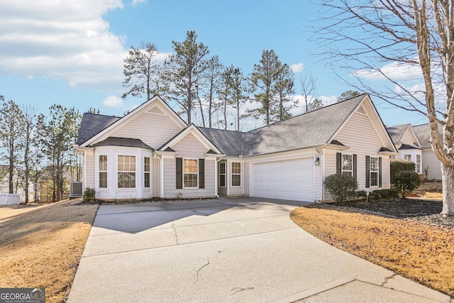 view of front of property featuring a garage and a front lawn