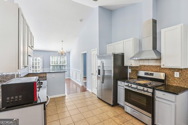 kitchen featuring sink, dishwasher, kitchen peninsula, ceiling fan, and backsplash