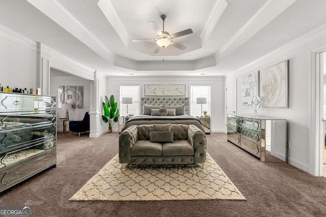 carpeted bedroom with a raised ceiling, crown molding, and multiple windows