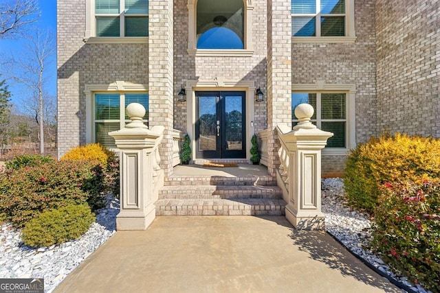 view of exterior entry featuring french doors