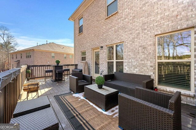 deck featuring an outdoor living space