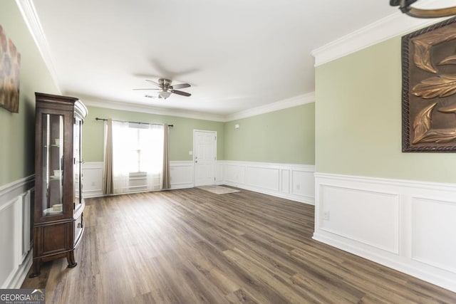 unfurnished living room with crown molding, ceiling fan, and dark hardwood / wood-style flooring