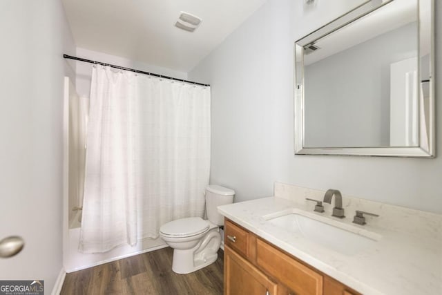 full bathroom featuring shower / bath combination with curtain, vanity, toilet, and hardwood / wood-style flooring