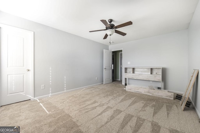 unfurnished bedroom with carpet floors and ceiling fan