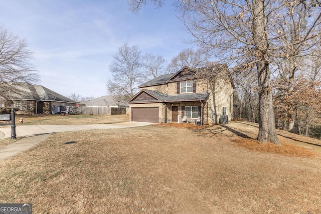 view of front property with a garage and a front yard