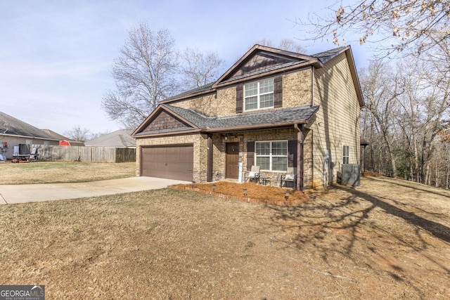 view of front of house featuring a garage and a front yard