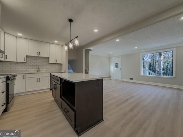 kitchen featuring light stone countertops, white cabinetry, appliances with stainless steel finishes, and sink