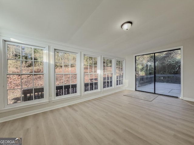 empty room featuring crown molding and light hardwood / wood-style flooring