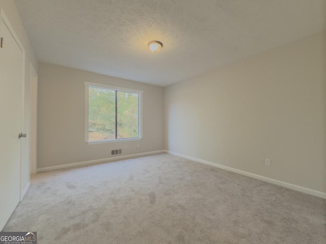 spare room with carpet