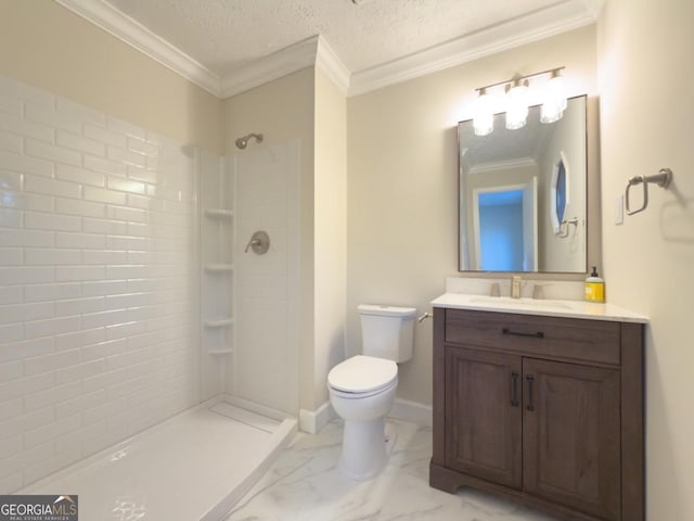 bathroom featuring vanity, ornamental molding, a textured ceiling, toilet, and walk in shower