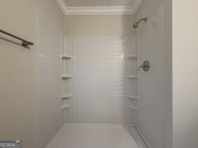 bathroom featuring crown molding, tiled shower, vanity, and a textured ceiling