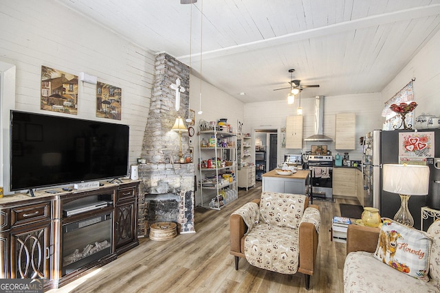 living room featuring wooden ceiling, ceiling fan, and light wood-type flooring