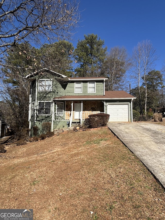 front of property with a garage and a porch