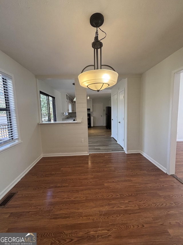 interior space with dark hardwood / wood-style flooring