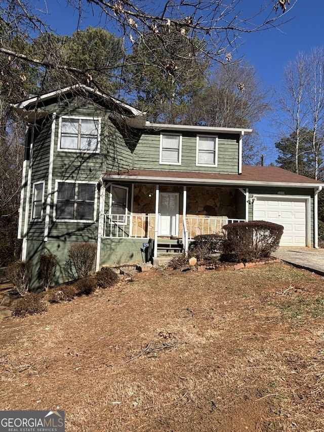 view of front property with a garage and covered porch