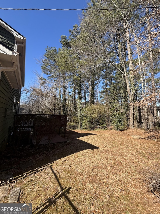 view of yard featuring a wooden deck