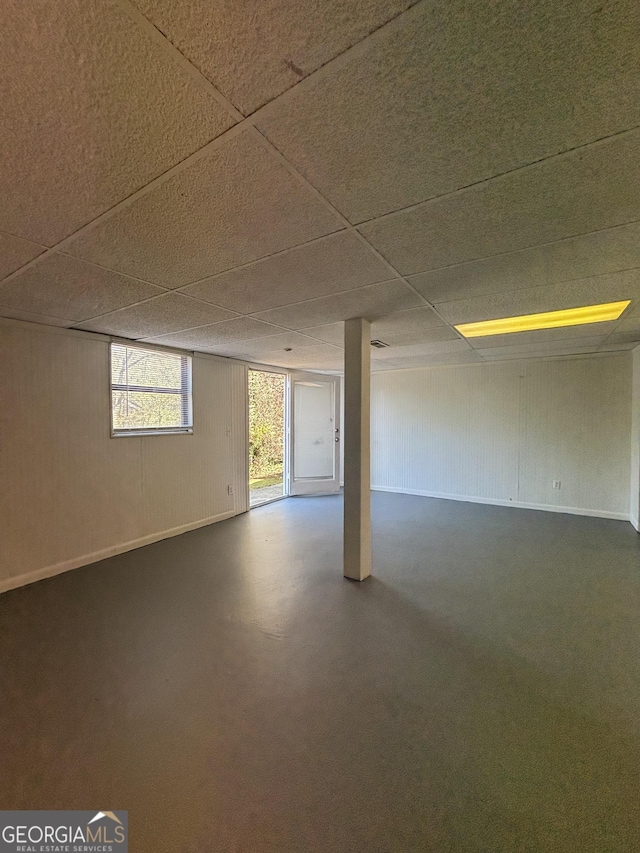 basement featuring a drop ceiling