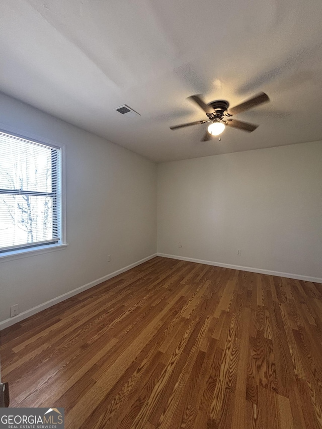 unfurnished room featuring hardwood / wood-style floors, a textured ceiling, and ceiling fan