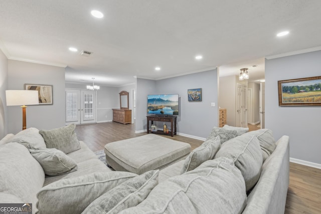 living room with ornamental molding and dark wood-type flooring