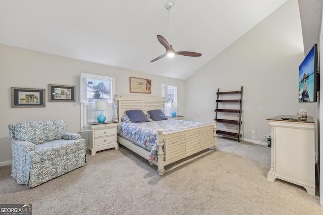 bedroom featuring light carpet, vaulted ceiling, and ceiling fan