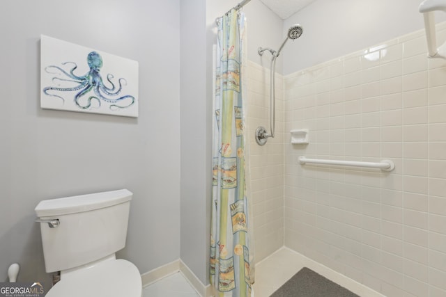 bathroom with a shower with curtain and toilet