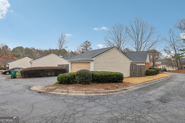 view of side of property with a garage