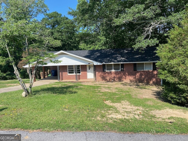 single story home featuring a carport and a front yard