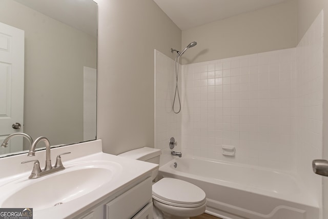 full bathroom with vanity, toilet, and tiled shower / bath combo