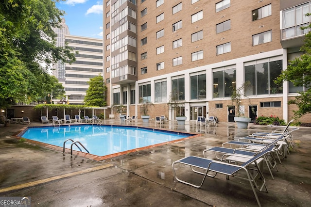 view of swimming pool with a patio area