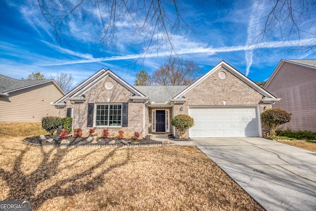 view of front of home featuring a garage and a front yard