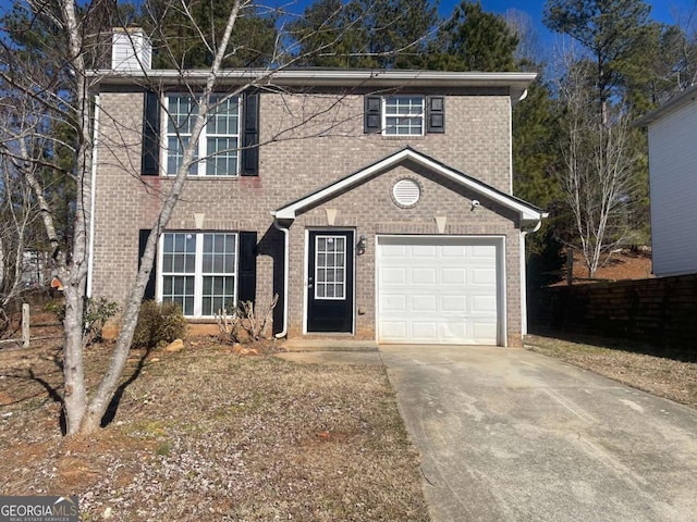 front of property with a garage