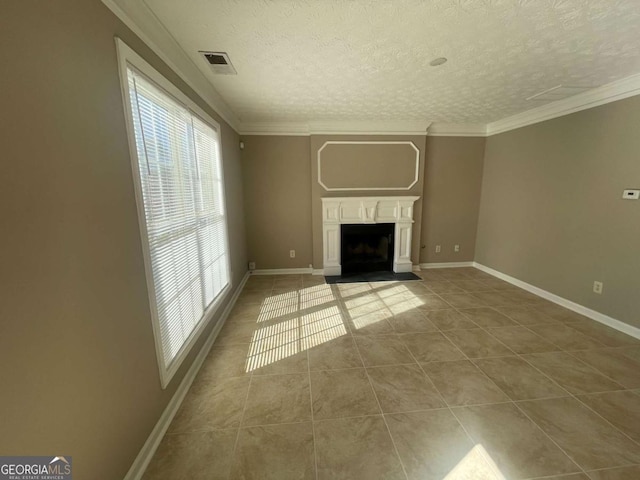 unfurnished living room featuring tile patterned flooring, ornamental molding, and a textured ceiling