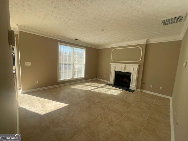 unfurnished living room featuring ornamental molding, tile patterned floors, and a textured ceiling