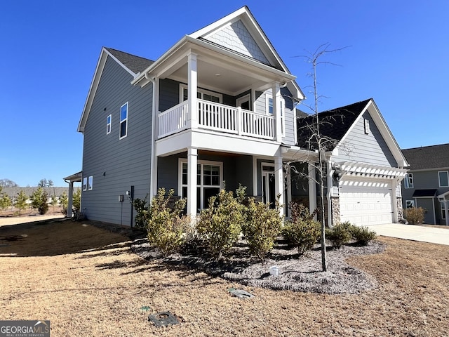 view of front of house with a garage and a balcony