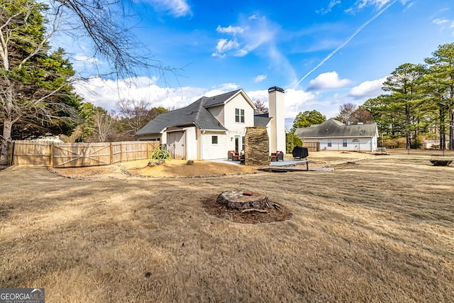 exterior space featuring a yard, a fire pit, and a patio