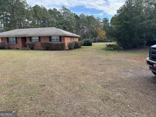 exterior space with a front yard